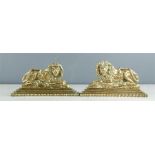 A pair of 18th century bronze chimney ornaments in the form of lions.