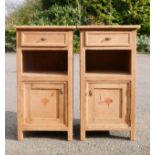 A pair of antique pine cabinets.