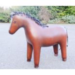 A large leather clad model of a horse / footstool