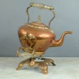 A copper Victorian kettle on stand with glass handles.