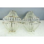 A pair of cut glass basket chandeliers, with faceted drops.