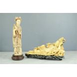 Two Chinese resin carved figurines.