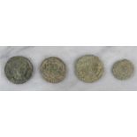 Numismatic: a group of four Roman coins.