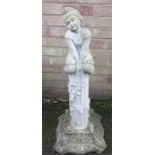 A reconstituted stone garden ornament in the form of a girl on a plinth.