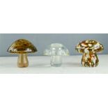 Three mushroom form glass paperweights including Wedgwood, Mdina.