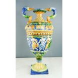 A Majolica Italian urn, modelled with bird head handles.