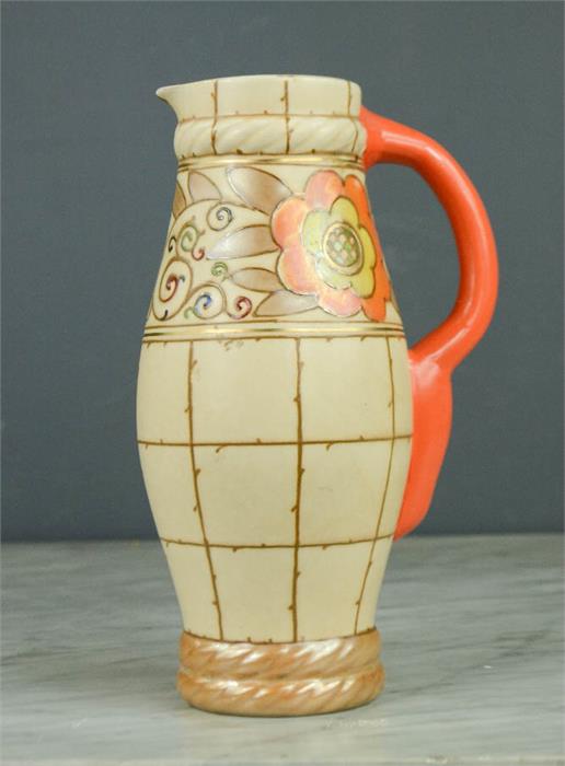 A Charlotte Rhead jug, Bursleyware, no 325 to base, 24cm high.