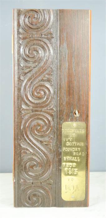 A carved oak box with a brass plaque stamped 'Documents of Ivy Cottage,Foundry Road, Ryhall,