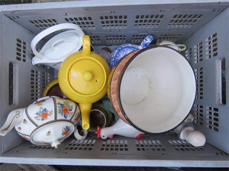 Ceramics including yellow tea pot and Royal Doulton tea pot.
