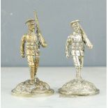 Two silver plated model soldiers.