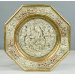 An early Indian dish, of hexagonal form, embossed with decoration.