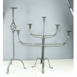 Two Gothic style wrought iron table candelabras.