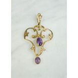 A 9ct gold Edwardian pendant set with seed pearls and oval amethysts, 2g.