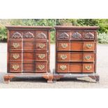 A pair of small mahogany chest of drawers, carved with shell motifs. [Provenance: Gumley Hall,