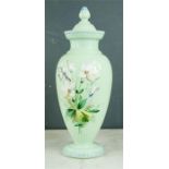 A green glass bohemian vase with enamelled flowers.