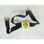 A 9ct gold ladies wristwatch with canvas strap.
