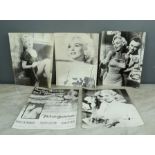 A group of black and white Marylin Monroe photographs.