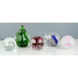 Five glass paperweights including Caithness Silver Rain M70313, Wedgwood seal paperweight, and a