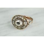 A rose gold (unmarked) silver and diamond ring, oval setting rough cut, size P/Q, 6g.