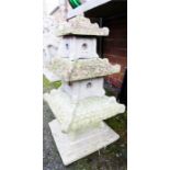 A reconstituted stone garden ornament in the form of a Chinese pagoda.