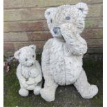 Two garden ornaments in the form of bears.