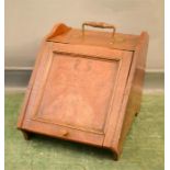 An oak inlaid coal scuttle, with copper handle.