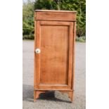 An antique oak cabinet with ceramic handle.