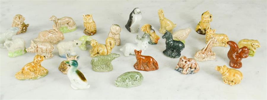 A group of Wade figurines.