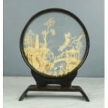 A Chinese cork picture in a black lacquered roundel glazed case.