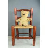 A Chad Valley 1950s teddy bear and child's chair.