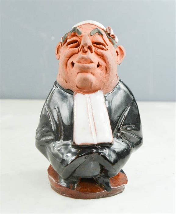 A Chelsea pottery figure of a Judge.