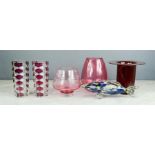 A group of glassware including Murano glass fish, cranberry glass, and a pair of retro vases.