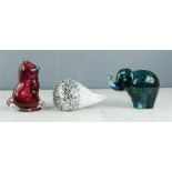 Three glass paperweights including Wedgwood hedgehog, elephant and a cat.