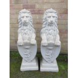 A pair of concrete lions with Shields.
