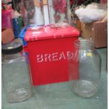 A group of vintage sweet jars, together with a bread bin.