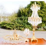 A quantity of crystal lamps, chandelier and table lamp.
