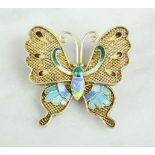 A silver gilt and enamel butterfly brooch.