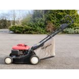 A Honda Eco HRG 410 petrol Lawnmower.