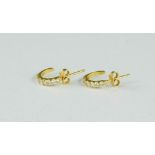 A pair of 18ct gold and diamond earrings, 3g.