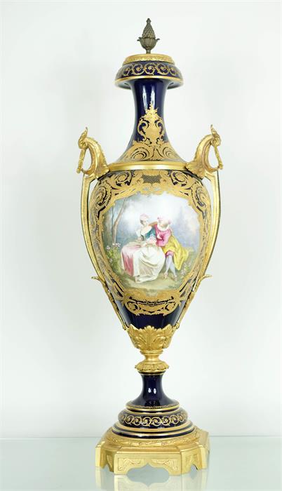 A French Ormolu-Mounted Sèvres Style Porcelain Vase, cobalt blue ground and hand painted oval