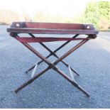 A mahogany butlers tray and stand.