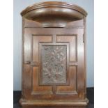 An oak corner cupboard 65cm high.