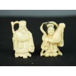 Two carved bone Chinese figures.