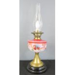 A paraffin lamp converted to electric, pink vessel, frosted globe, 57cm high.