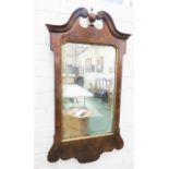 A Georgian style wall mirror with vase form surmount.