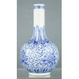 A Chinese blue and white bottle vase, with calligraphy marks to base, 54cm high.