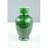 A Victorian green vase, continental. 17cm high, 9cm wide.