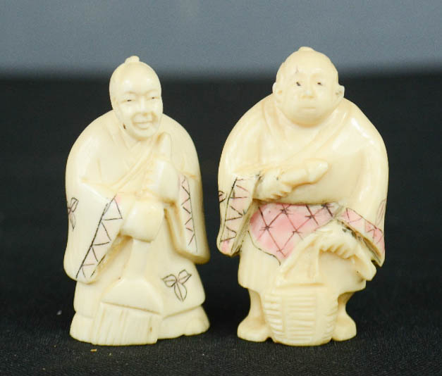 Two carved bone Chinese figures.