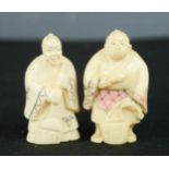 Two carved bone Chinese figures.