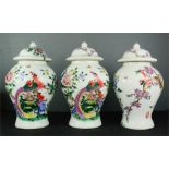 A trio of Chinese vases, decorated with flowers and birds, 54cm high